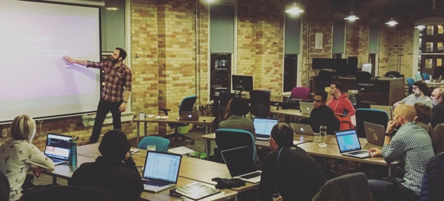 Jeremy standing at the front of class teaching the ModernWeb course